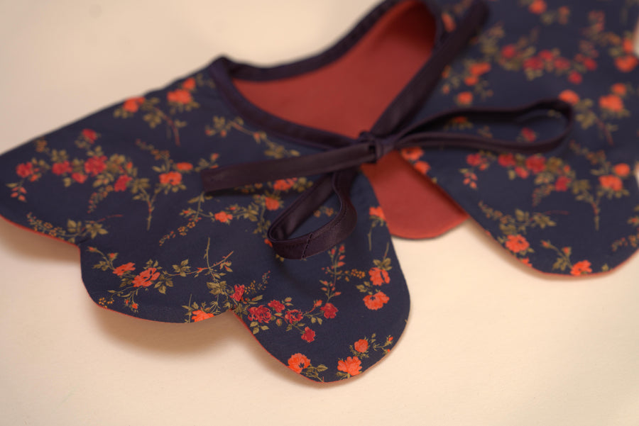 red collar with navy and red flowers