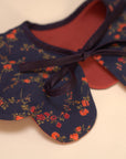 red collar with navy and red flowers