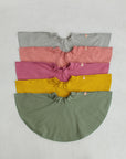 grey, pink, dark pink, yellow and olive skirt