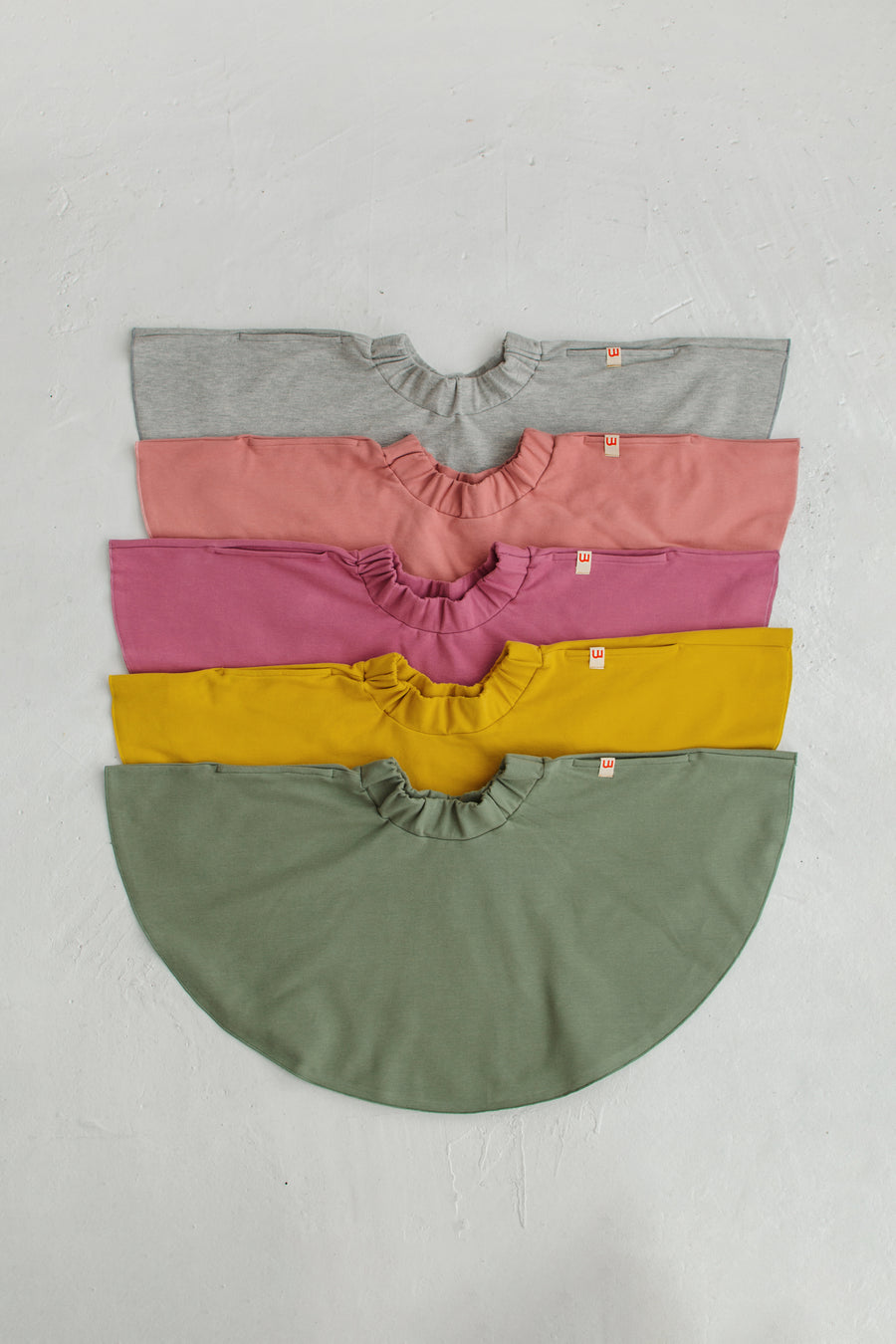 grey, pink, dark pink, yellow and olive skirt